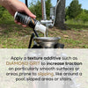Example of someone pouring Diamond Grit Texture additive into a sprayer for sealer application