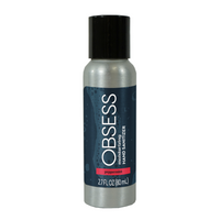 Silver 2.7 oz bottle with black pop up dispenser lid and blue label saying "OBSESS moisturizing hand sanitizer peppermint"