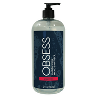 Clear 31 oz bottle with black pump dispenser lid and navy blue label saying "OBSESS moisturizing hand sanitizer peppermint"
